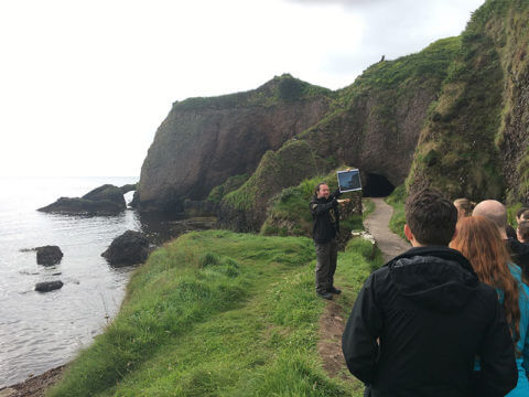 Game of Thrones Tour: Robbie, the guide, comparing art (on the tablet) with the real thing