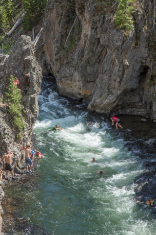 Family Road Trip: The slotted canyon where adventurers take a ride down the rapids of Yellowstone's Firehole River | NextTribe