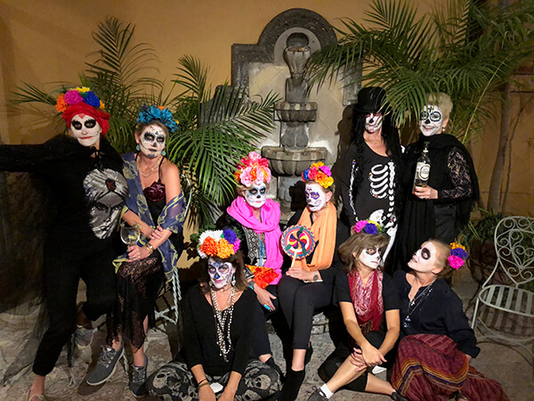 Photo of travelers in full day of the dead regalia