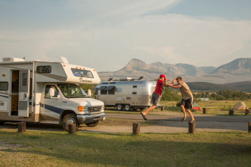 Family Road Trip: The boys being typical siblings at a campground in Glacier National Park | NextTribe
