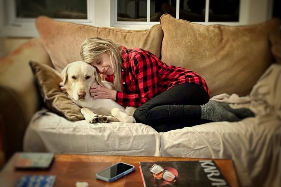 Sally and her dog Moe cuddling